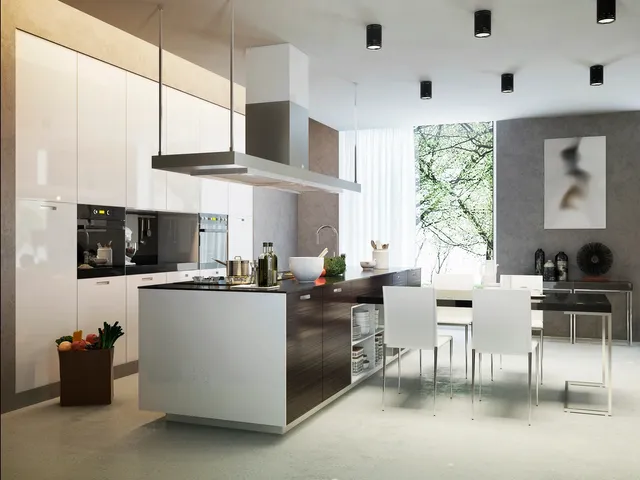 A kitchen with white walls and a large island.